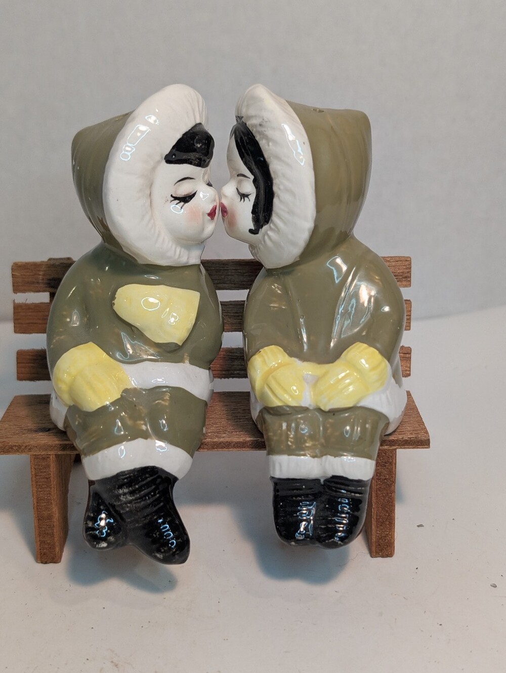 Vintage, mid-century ceramic salt and pepper shakers featuring a kissing couple.